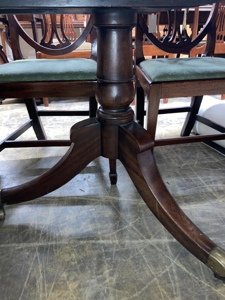 A George IV mahogany twin pedestal dining table, 220cm extended, one spare leaf, width 91cm height 72cm